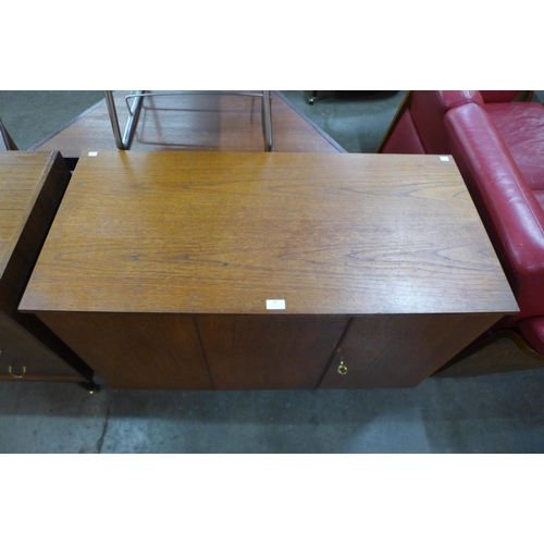 66 - A teak metamorphic home office desk