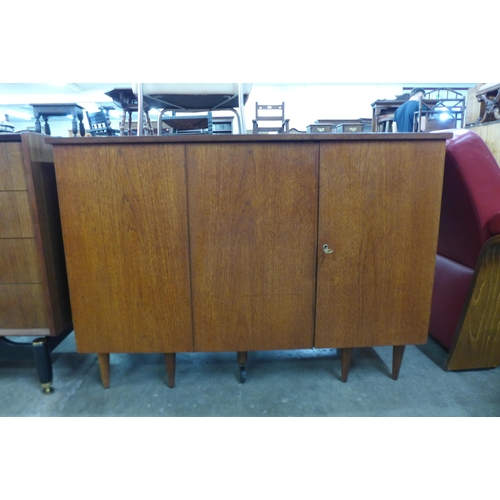 66 - A teak metamorphic home office desk