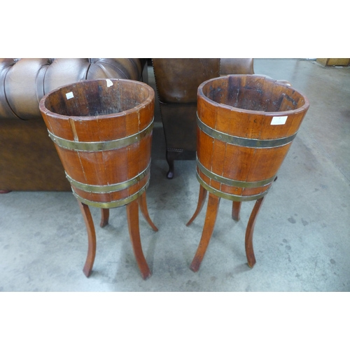 7 - A pair of Edward VII oak and brass bound jardinieres on stands