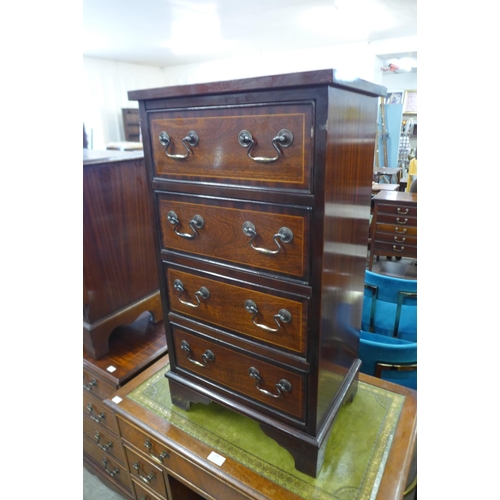 98 - A small inlaid mahogany chest of drawers