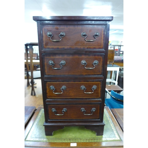 98 - A small inlaid mahogany chest of drawers