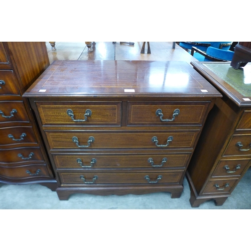 99 - An inlaid mahogany chest of drawers