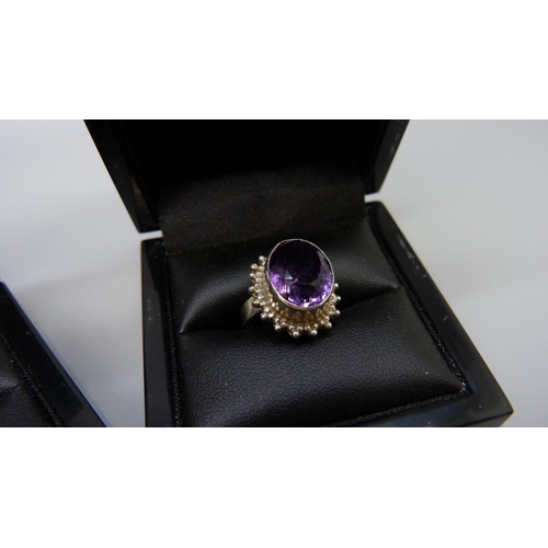 1000 - Three silver and amethyst rings