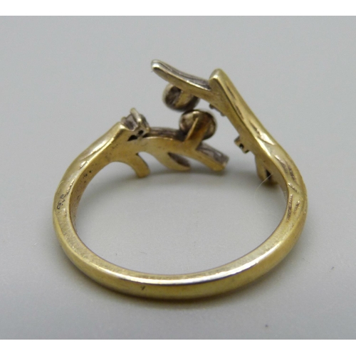 1005 - A silver-gilt dress ring, U