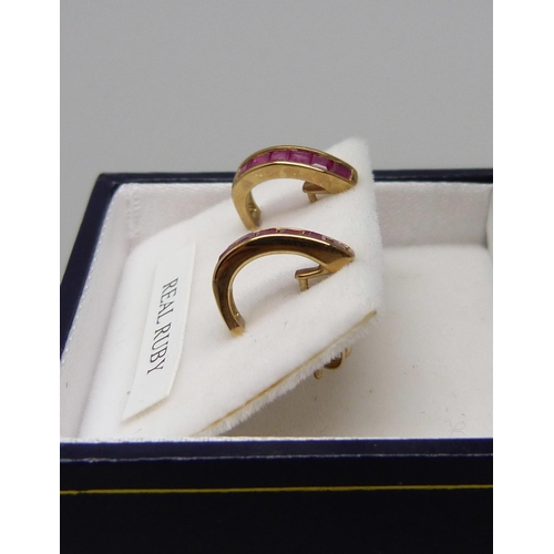 1022 - A pair of 9ct gold ruby earrings, 1.5g, boxed