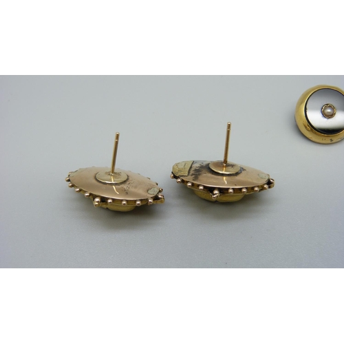 1034 - A pair of Victorian yellow metal earrings and a gold mounted brooch, 9.3g