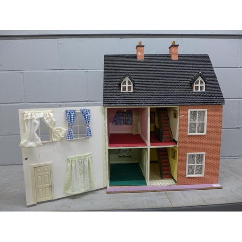 1057 - A 1970's/1980's wooden dolls house with electrics **PLEASE NOTE THIS LOT IS NOT ELIGIBLE FOR POSTING... 