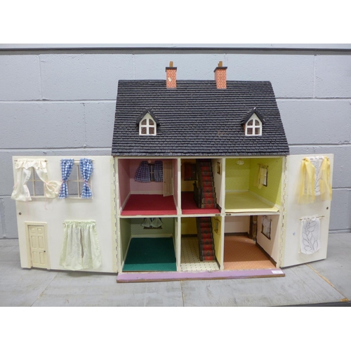 1057 - A 1970's/1980's wooden dolls house with electrics **PLEASE NOTE THIS LOT IS NOT ELIGIBLE FOR POSTING... 