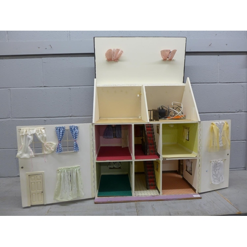 1057 - A 1970's/1980's wooden dolls house with electrics **PLEASE NOTE THIS LOT IS NOT ELIGIBLE FOR POSTING... 