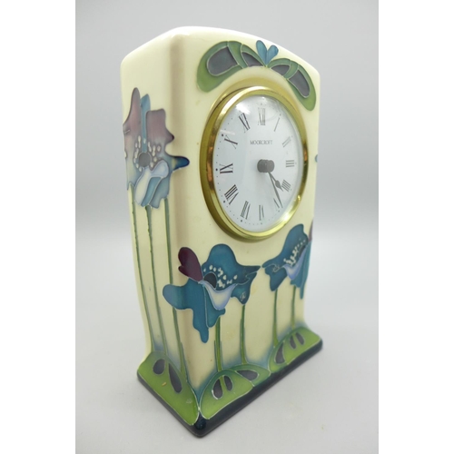 605 - A Moorcroft Blue Heaven clock, 15cm