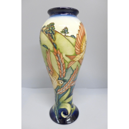 620 - A Moorcroft vase, Larks Ascending, designed by Philip Gibson, limited edition, 27cm, boxed, £288 whe... 