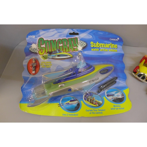 638 - A Stingray submarine toy in a packet and two Corgi cars, including Fab1, with missile and a Noddy ca... 