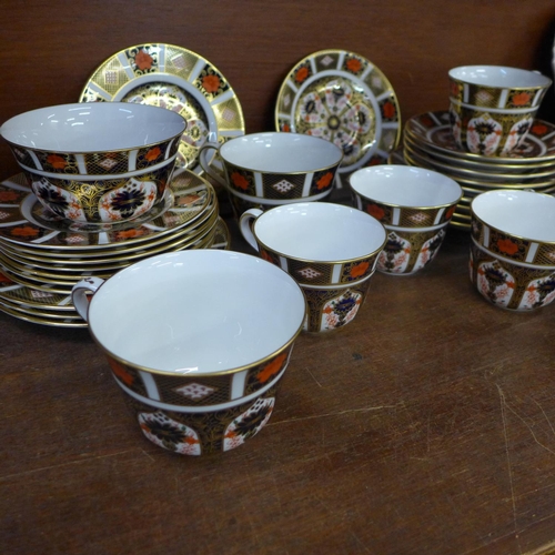 686 - A collection of Royal Crown Derby 1128 pattern teawares, seven cups, four large and six small saucer... 