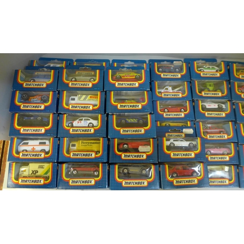 733 - Fifty-eight dark blue box Matchbox die-cast model vehicles, boxed