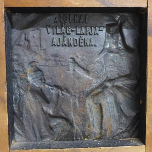 789 - A bronze plaque, after Kallos Ede, mounted on a wooded plaque