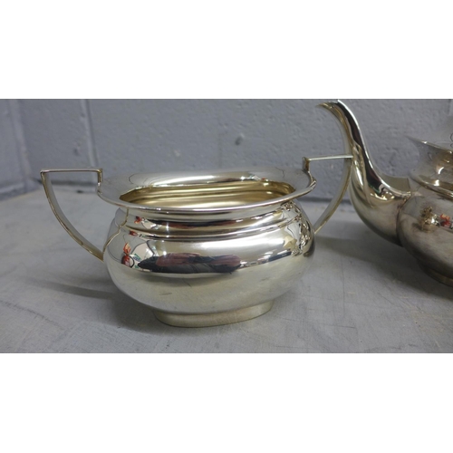 797 - A three piece silver plated tea service