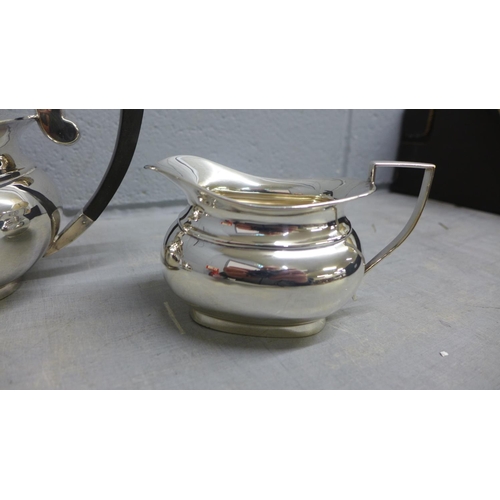 797 - A three piece silver plated tea service