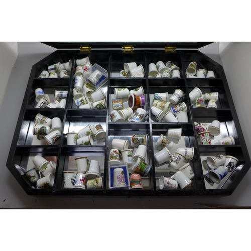 817 - A display case with 93 ceramic thimbles **PLEASE NOTE THIS LOT IS NOT ELIGIBLE FOR POSTING AND PACKI... 