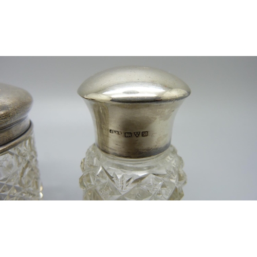 840 - Three silver topped jars