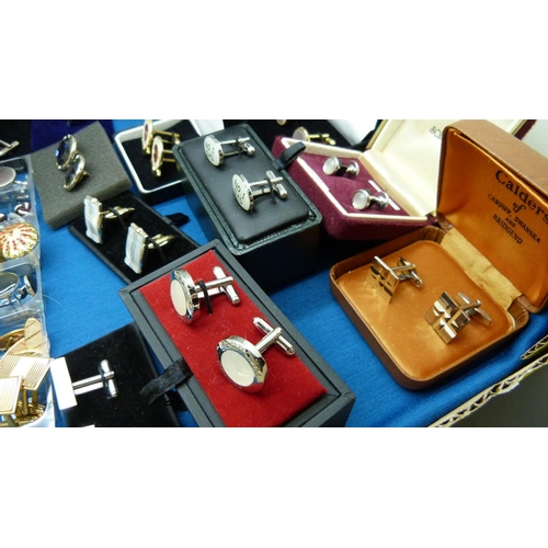 868 - Thirty five pairs of cufflinks and nine tie pins