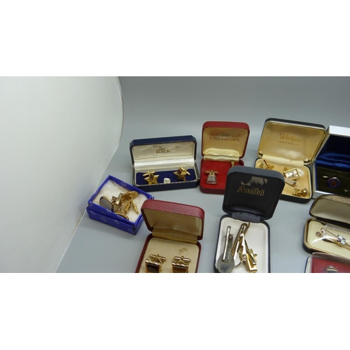 877 - A collection of cufflinks and tie pins