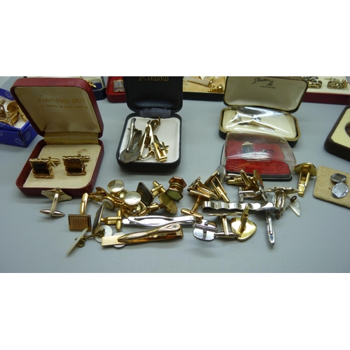 877 - A collection of cufflinks and tie pins