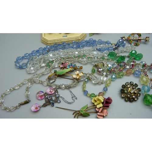 886 - A collection of costume jewellery including a matching brooch and earrings set, paste and stone set ... 