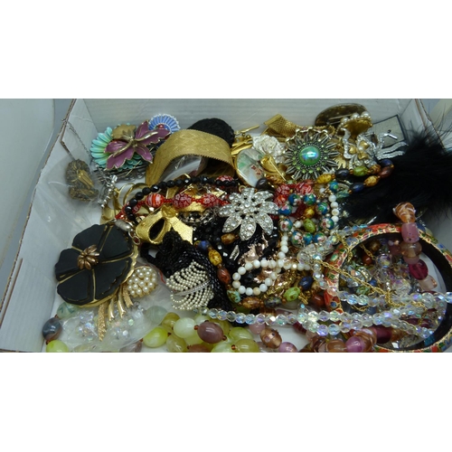 889 - A collection of costume jewellery, enamelled flower brooches, bracelets, bead necklaces, etc.