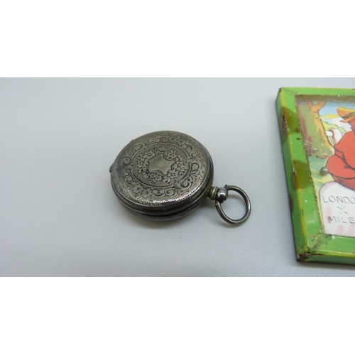 902 - An Art Nouveau tin, Dick Whittington game and a silver fob watch, a/f