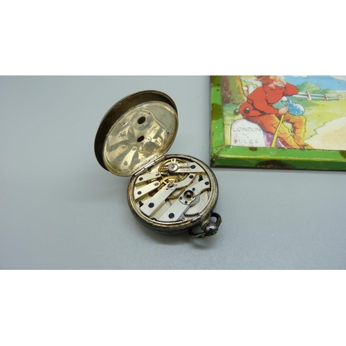 902 - An Art Nouveau tin, Dick Whittington game and a silver fob watch, a/f