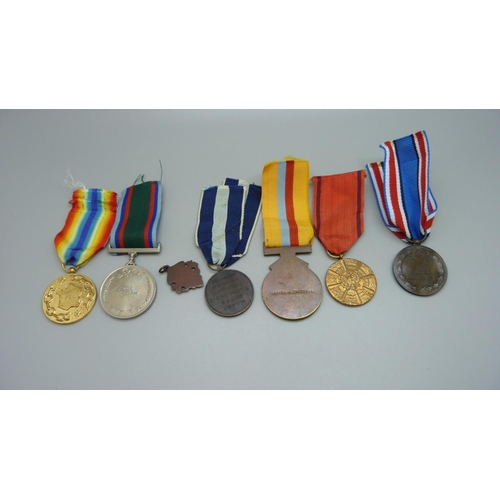 909 - Six assorted medals including Defence of Zimbabwe