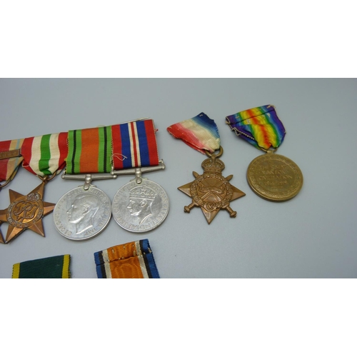 913 - A set of nine medals; five WWII medals and bar and a trio of WWI and Territorial Efficient Service m... 