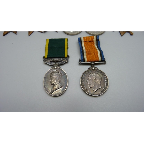 913 - A set of nine medals; five WWII medals and bar and a trio of WWI and Territorial Efficient Service m... 