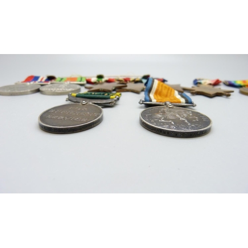 913 - A set of nine medals; five WWII medals and bar and a trio of WWI and Territorial Efficient Service m... 