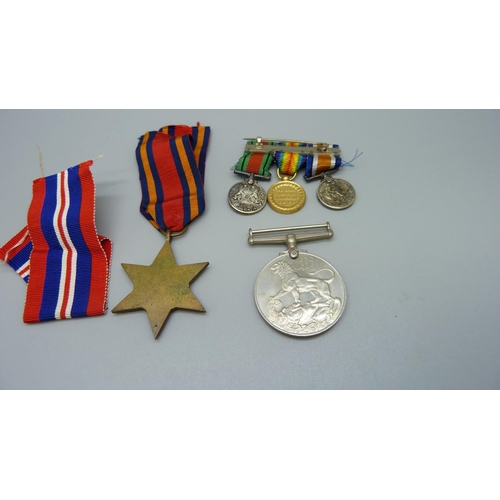 917 - A WWII XXXCorps medallion, two WWII medals and three miniature medals