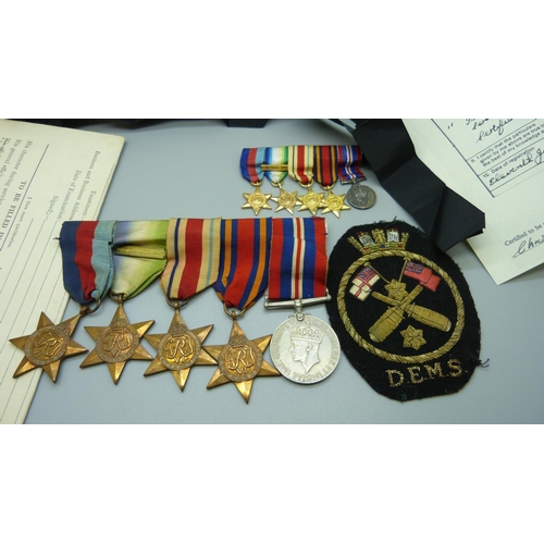 921 - An interesting Naval set of five WWII medals and modern miniatures along with complete service paper... 