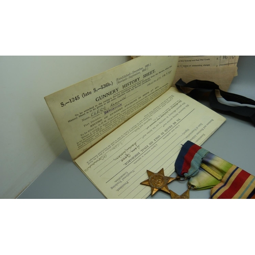 921 - An interesting Naval set of five WWII medals and modern miniatures along with complete service paper... 