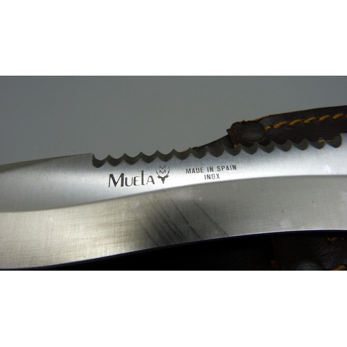 932 - A Muelay dagger with saw back, made in Spain, with leather scabbard