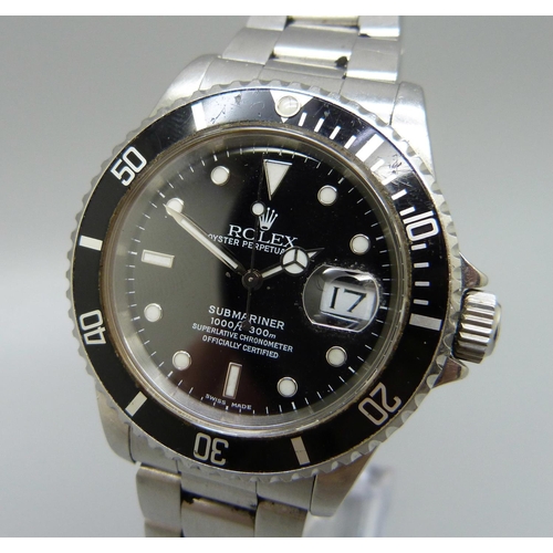 942 - A Rolex Oyster Perpetual Submariner wristwatch, stainless steel case and bracelet strap, dial marked... 