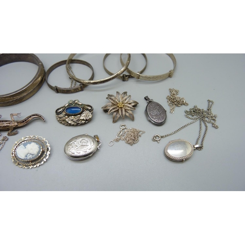 945 - Four silver lockets, six silver bangles, six brooches including silver