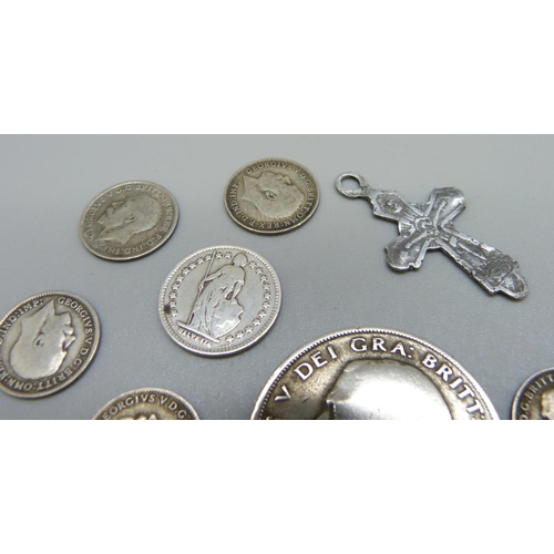 988 - Eight assorted silver coins and a silver cross, 24g