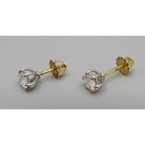 990 - A pair of 18ct gold and diamond stud earrings, approximately 0.80ct diamond weight