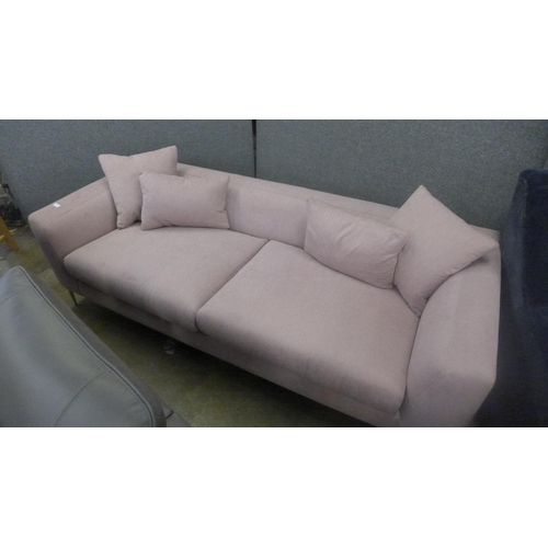 1322 - A sherbet pink velvet three seater sofa