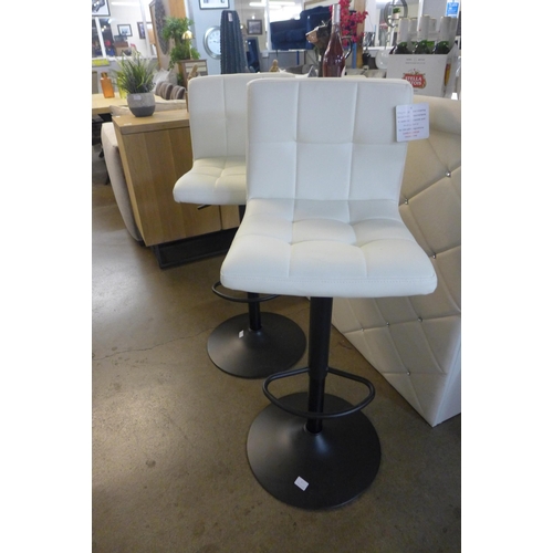 1312 - A pair of black and cream bar stools