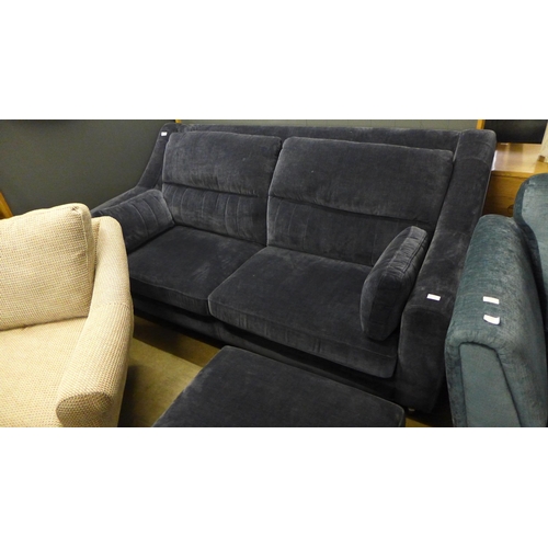 1419 - A midnight blue velvet, high back three seater sofa and footstool