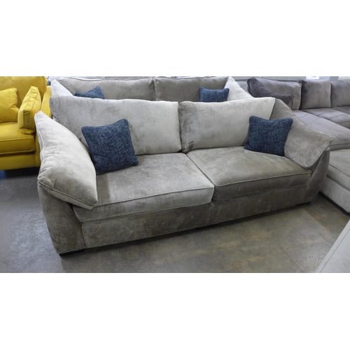 1523 - A mink upholstered four seater sofa with blue scatter cushions and black oak feet - RRP £1799