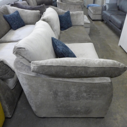 1524 - A mink upholstered four seater sofa with blue scatter cushions and black oak feet - £1799