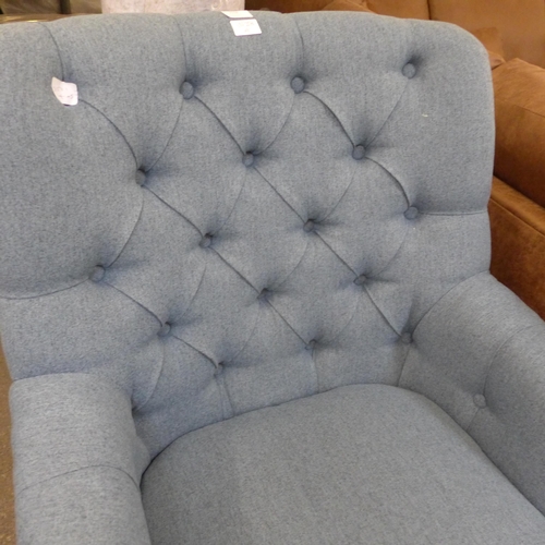 1538 - An Atlanta blue stone armchair