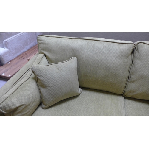 1545 - A lime green corduroy three seater sofa with black oak legs RRP £1439