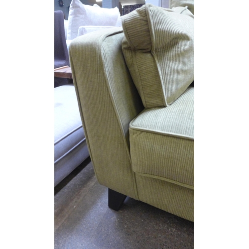 1545 - A lime green corduroy three seater sofa with black oak legs RRP £1439